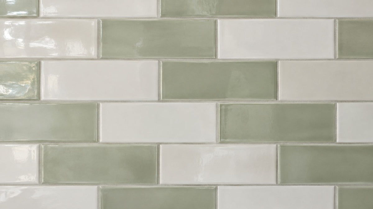 Glossy white and sage-green ceramic subway tile splashback