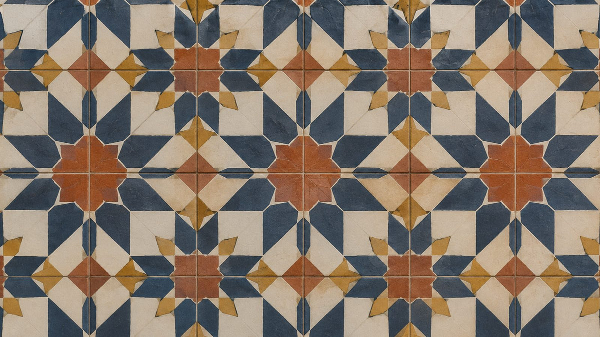 Patterned encaustic cement tile floor in navy, terracotta and mustard