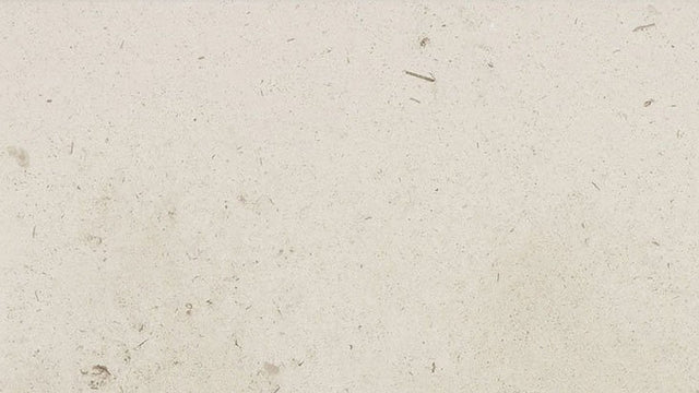 Close-up of honed cream limestone surface